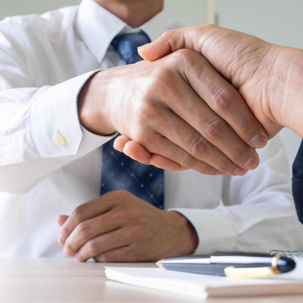 businessmen-shake-hands-after-completing-the-company-registration-contract-documents-contract-and-lawyer-meeting-concept-free-photo